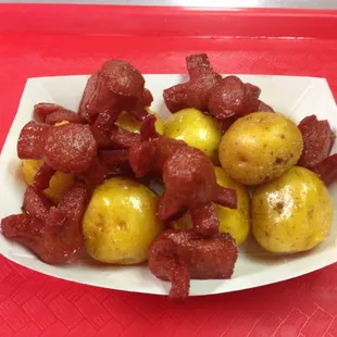 Salchipapa (Colombian yellow potatoes And small pieces hoy dogs