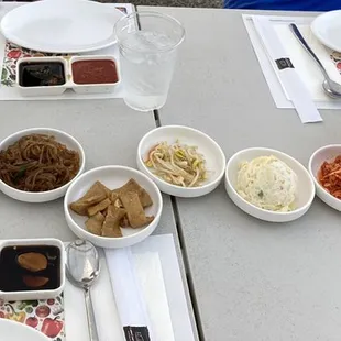 Lots of ban Chan! Broccoli, cucumbers, jap chae, fish cake, bean sprouts, potato/Mac salad, spicy bean sprouts, and salad