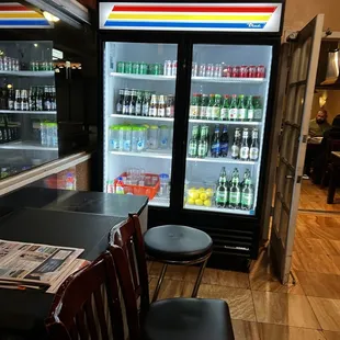 a bar with a beverage cooler