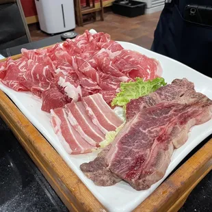 Brisket, Pork Belly, and Short Ribs.