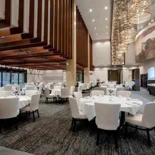 The main dining room is adorned with tasteful decor, featuring rich wooden furnishings and carefully chosen accents.