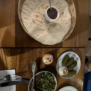 Freshly baked bread, lamb stuffed grape leaves, Adjapsandali