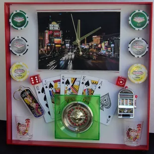 Vegas Strip Clock with poker chips,dice,dancing girl, roulette wheel,royal flush, 2 shot glasses and slot machine. For Sale $30