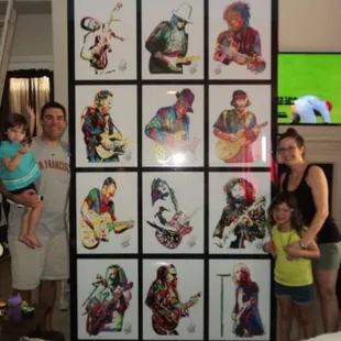 The Wanco Family alongside my 5FT x 9FT Black Acrylic Shadow Box Frame with 12 Guitar Legends Mounted Inside!