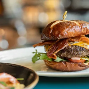 a burger with bacon and lettuce