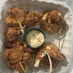 fried chicken and doughnuts in a styrofoam container