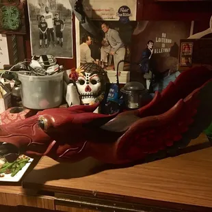 a cluttered desk with various items