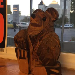 a wood carving of a bear