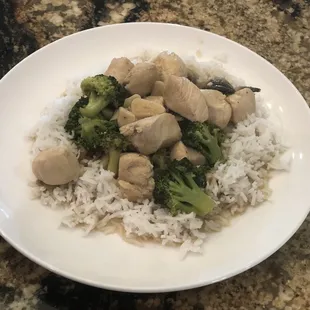 Chicken with broccoli served over rice