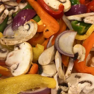 a mixture of mushrooms, peppers, onions, and peppers