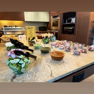 a kitchen counter with a variety of foods on it