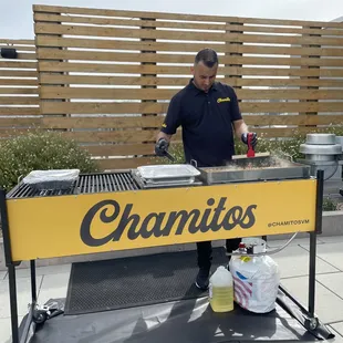 a man preparing food on a grill