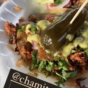 El pastor tacos with guacamole and red salsa