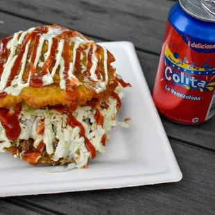 a can of soda and a sandwich