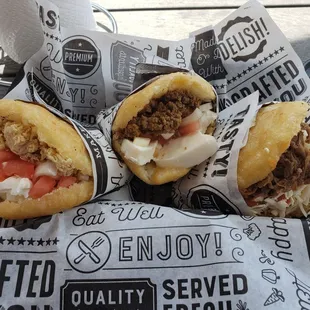 1 shredded chicken, 1 beef and 1 shredded beef Arepas...all with onion, tomato, cheese