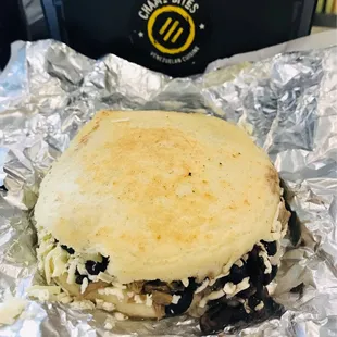 Arepa pabellon - shredded beef, sweet plantain, black beans, cheese