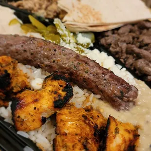 Close up chicken shish taouk and beef kafta.