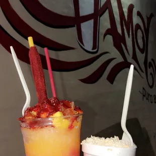 two people holding drinks in their hands