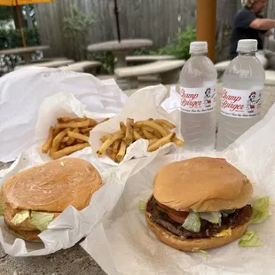 two burgers and french fries