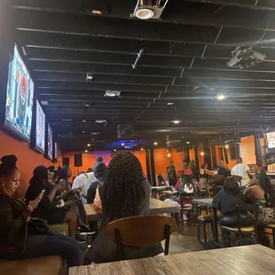 a crowd of people sitting at tables