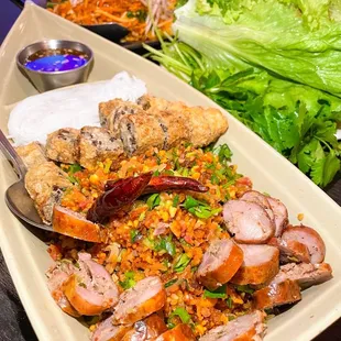 Champa Sampler (Lao sausages, fried rice ball salad, fried spring rolls, lettuce wrap) must try!