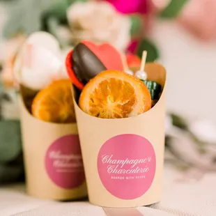 orange slices in paper cups