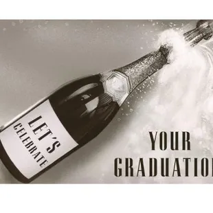 a black and white photo of a bottle of champagne