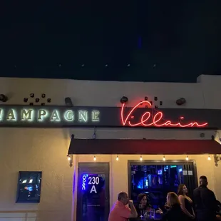 a group of people outside a restaurant