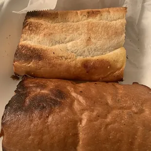 Bread hard and burnt with cheese only in the middle of bread.......