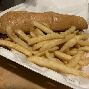 Italian beef sandwich with french fries.