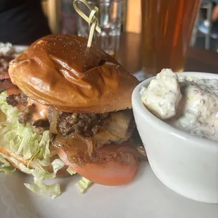 Champion burger with bacon and potato salad