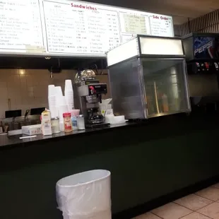 the counter and menus of the restaurant