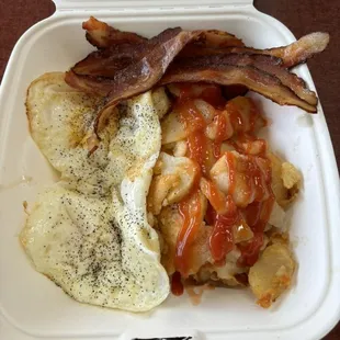 2 eggs, a meat, and potatoes.