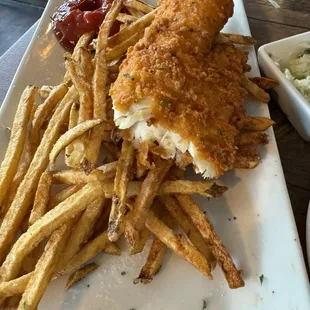 Fish and Chips and this is AFTER I cut in in half. Huge piece of fresh Haddock.