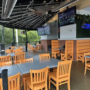 Outdoor seating. Lots of TVs.