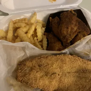 a tray of fried fish and french fries