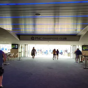 Walking in with a food court / bar to the left and right