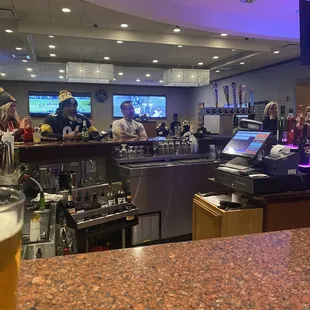 a bar with a glass of beer