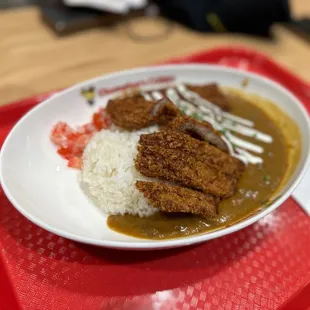a plate of curry and rice