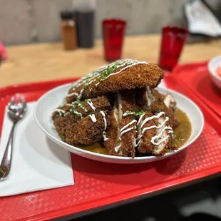 a plate of fried food on a tray
