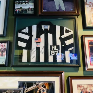 a number of framed sports memorabilia