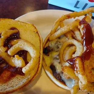 burger open-faced with barbeque sauce and onion straws