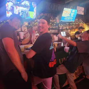 a group of people at a bar