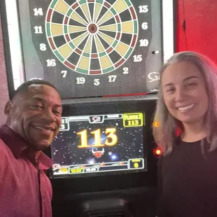 Enjoying a few games of darts with a few beers