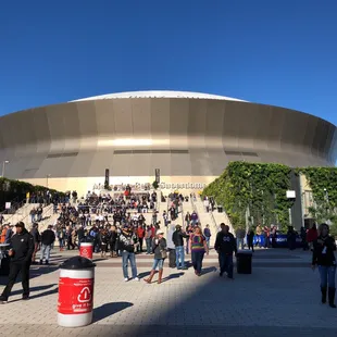 a crowd of people walking around the arena