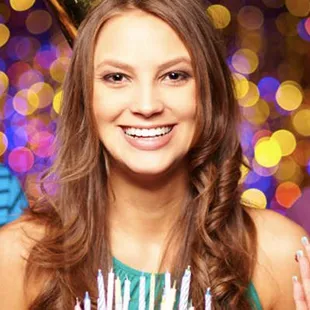 a group of young people celebrating a birthday