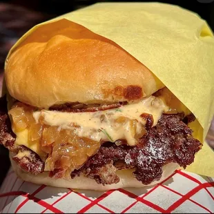 a close up of a cheeseburger