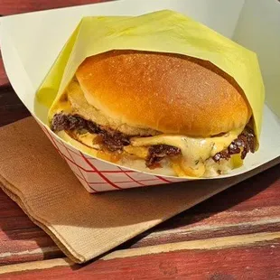 a cheeseburger in a basket