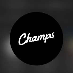 a black circle with the word champs on it