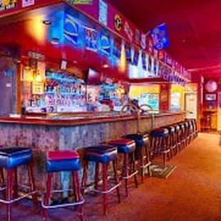 a bar with blue stools